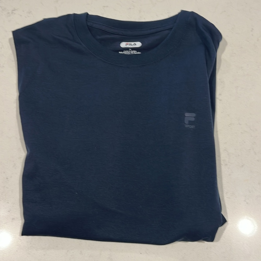 NWOT, never worn. Still has new folds. Men’s Filament sleeveless athletic
